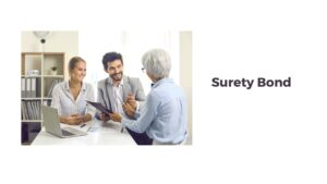 Surety Bond - A surety agent is talking to business couple about their bond's need on a white table.